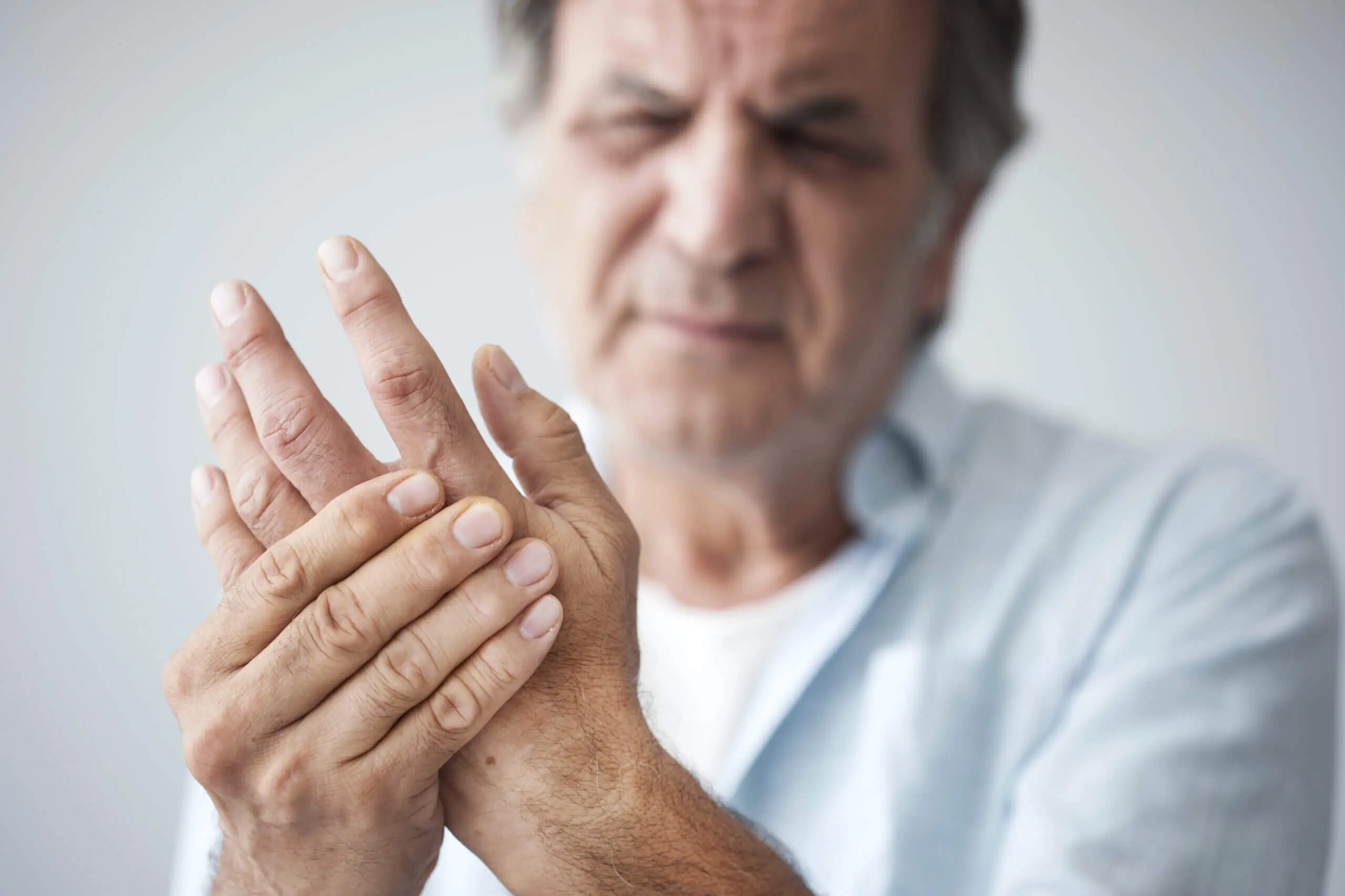 oldmanwithfingerpain-scaled Image of person with sore hand